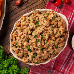Traditional turkey stuffing consists of bread with onions, butter and herbs. Sometimes sausage or ground meat is added top view