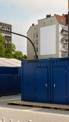 urban mockup featuring a large empty billboard on a residential building facade. The blank poster space is clean and centered, with a 4:5 portrait ratio, ideal for street ad design previews.
