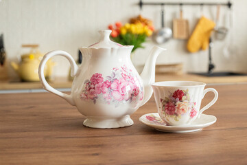 Beautiful cup of tea and flowers in the kitchen