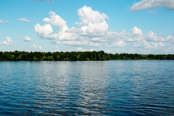 Panoramic view of the Dnieper river bank from the embankment of the city of Dnieper. Reflection of...