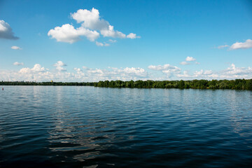 Panoramic view of Pridneprovsk city of Dnepr. Ukraine. Reflection of sky with clouds on water surface.