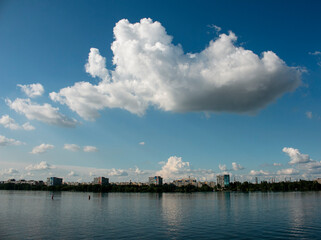 Panoramic view of left bank of Dnieper River. Dnieper. Ukraine. Reflection of the sky with clouds on the water surface.