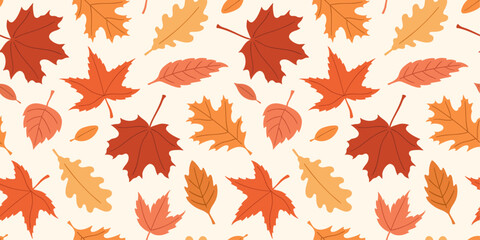 Seamless vector cozy pattern with autumn red, orange, and yellow leaves