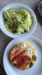 Well-balanced breakfast featuring healthy source of ptotein, fermented and fresh vegetables, salad and nuts on a plate. Top view real kitchen photo, diet and self care and love concept