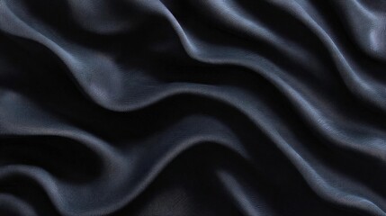 Obraz premium Close-up of a dark blue fabric with a smooth and elegant texture. the fabric appears to be made of a silky or satin-like material, with a subtle sheen that catches the light.