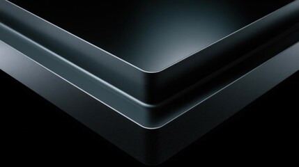Close-up of a black surface with a curved edge. the surface appears to be made of a glossy material, possibly leather or a similar material.