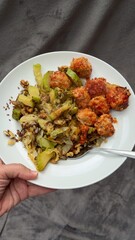 Well-balanced breakfast featuring healthy source of ptotein, fermented and fresh vegetables, salad and nuts on a plate. Top view real kitchen photo, diet and self care and love concept