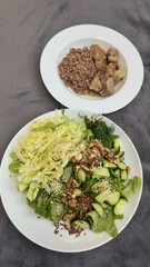 Well-balanced breakfast featuring healthy source of ptotein, fermented and fresh vegetables, salad and nuts on a plate. Top view real kitchen photo, diet and self care and love concept