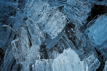 melting transparent ice on the shore of a lake in the north of Kolyma