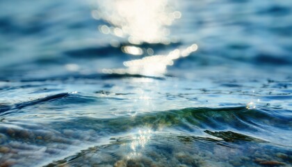 crystal clear shallow sea water close-up with sunlight reflections and pebbles under surface, perfect for ocean themed branding, web background, or print texture

