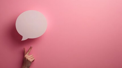 A hand points at a blank speech bubble on a soft pink background, evoking feelings of communication, expression, and connection, perfect for social media and discussions.