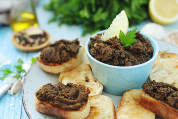 A bowl with tapenade - traditional olive dip in Mediterranean region	