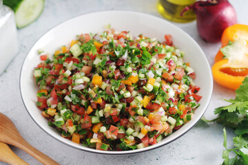 A bowl with traditional vegetable Israeli Salad