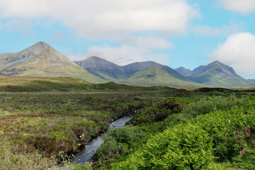 The rising mountains of Meall Odhar Beag, and Meall Odhar Mor, part of the Cuillin range, Isle of...