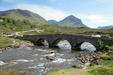 The peak of Sgurr nan Gillean poking out from the beneath the clouds, part of the Cuillin mountain range, viewed from the A87 road, in the Isle of Skye, Scotland, UK