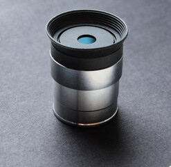 Telescope eyepiece with metal body isolated on black background