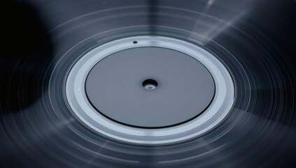 Spinning Vinyl Record: A Close-Up of Grooves and Central Label Detail