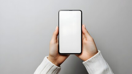 Hands Holding a Modern Smartphone with Blank White Screen for Custom Content Display
