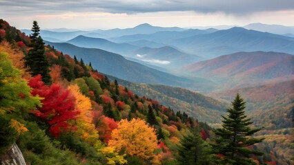 A panoramic view of a mountain range during the peak of autumn foliage