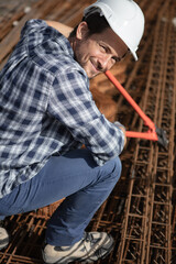 worker in a helmet working at a construction site