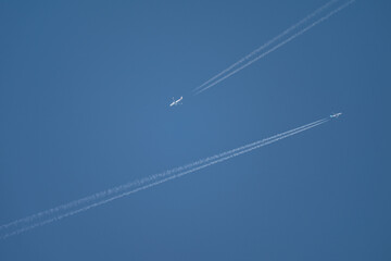 Parallel Journey: Two Airliners with Contrails in a Clear Blue Sky
