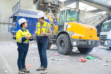 workers talking on refuse site