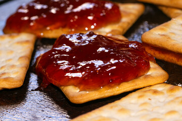 Cookies with strawberry marmalade , on the table