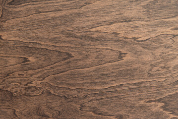 Dark walnut veneer surface with soft grain wood texture