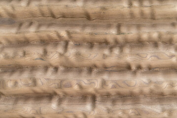 Natural carved wood panel with horizontal ripple relief