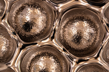Abstract golden gel texture with circular bubbles