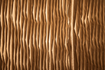 Natural vertical pleated beige fabric texture background