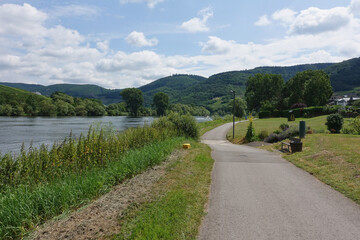 Picturesque Cycle Path along the Moselle River with Cloudy Blue Sky.