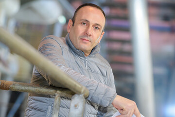 portrait of confident man in factory