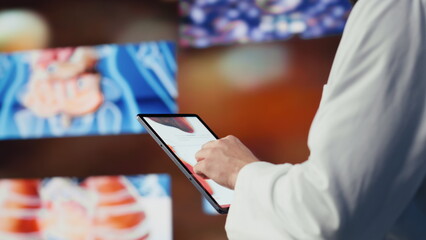 Male physician analyzing virtual health technology systems for a breakthrough, connected systems...