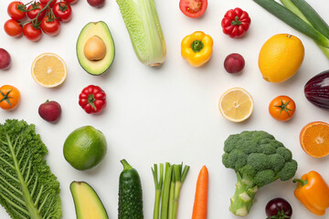 Vibrant Flat Lay of Fresh Fruits and Vegetables on White Background