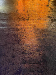 light reflecting on wet street