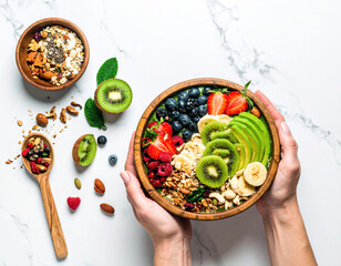 Hands holding healthy smoothie bowl filled with fruit, nuts, and granola toppings.