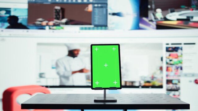 Chroma key tablet and digital interface connecting users to video entertainment networks. Isolated screen device in front of visualization of interconnected social media feeds - Powered by Adobe