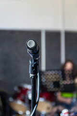 Musical rehearsal with microphone at a studio in the afternoon
