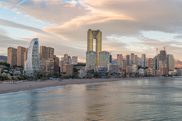 Sunset view of modern buildings in front of Poniente Beach in Benidorm, Spain