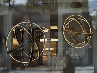 The store window has some modern designs.