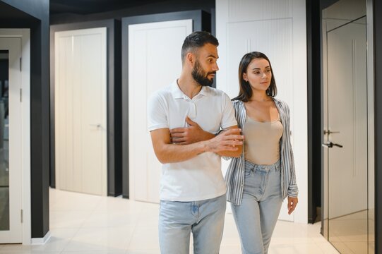 A young couple chooses interior doors for their new home.