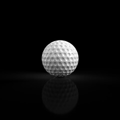White golf ball resting on reflective black surface