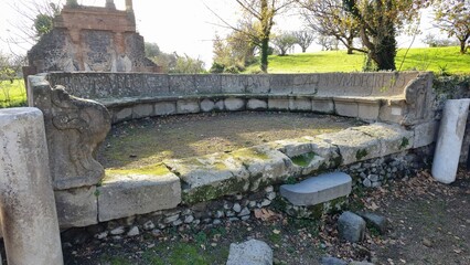 Pompeii, Italy – 8 January 2025. At the Necropolis of Porta Ercolano, a curved stone bench with...