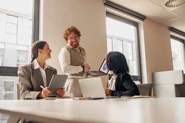 A dynamic, collaborative business meeting that showcases teamwork, advanced technology, and...