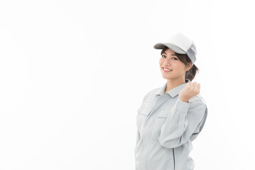 若い女性　作業着　ガッツポーズ