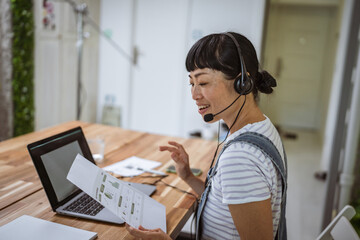 smile japanese woman operator with headset work from home, remote concept