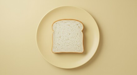 Top view of a single slice of white bread centered on a pale yellow oval plate against a minimalist matching background. Simple studio shot showcasing the carbohydrate food item.