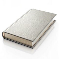 Fototapeta premium Elegant hardcover book with a metallic silver finish, lying closed on a white surface, suitable for design, publishing, or branding.