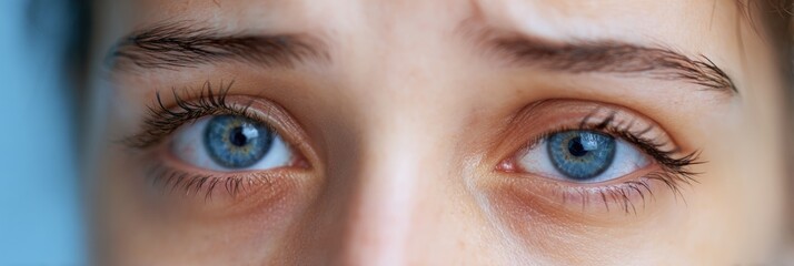 Eyes Exhibiting Twitching From Insomnia Against a Soft Blue Background During Late Night Hours